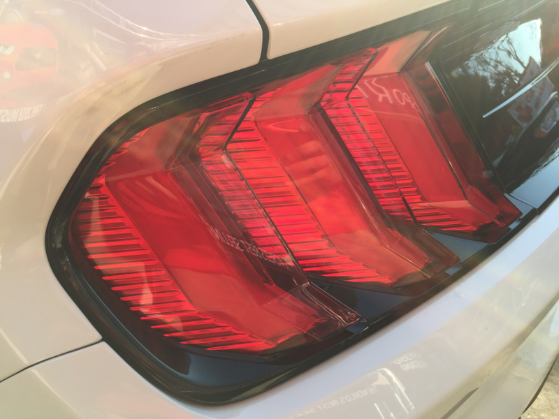 I actually really like the new tail lights and the bars on the deck lid panel. These match up to the surround much better